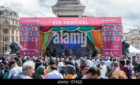 London, UK. 25 July 2015.  The EID Festival celebrates the end of Ramadan and an annual event takes place in Trafalgar Square.  This year marks the 10th anniversary of the free event as thousands of Londoners and tourists head to the square to listen to music, sample food from around the world as well as take part in special activities. Credit:  Stephen Chung / Alamy Live News Stock Photo