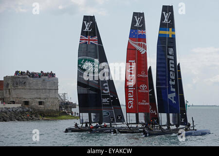 Portsmouth, UK. 25th July, 2015. Competing teams (L-R) Britain's Land Rover BAR (Ben Ainslie Racing), Emirates Team New Zealand and Sweden's Artemis Racing leave berth to compete in the first official race of the 35th America's Cup World Series Races at Portsmouth in Hampshire, UK Saturday July 25, 2015. The 2015 Portsmouth racing of the Louis Vuitton America's Cup World Series counts towards the qualifiers and playoffs which determine the challenger to compete against the title holders Oracle Team USA in 2017. Credit:  Luke MacGregor/Alamy Live News Stock Photo