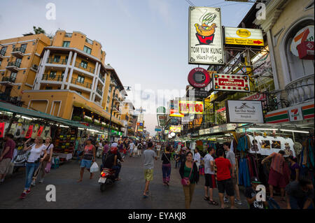 BANGKOK, THAILAND - NOVEMBER 16, 2014: Tourists and vendors share the pedestrianized street of Khao San Road backpacker center. Stock Photo