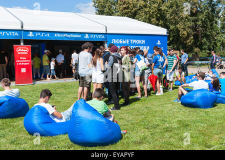 Moscow, Russia. 25th July, 2015. Moscow City Games 2015 sports festival took place at the Olympic Sport Complex Luzhniky of Moscow city. Unidentified young people by the pavilion of PlayStation. Credit:  Alex's Pictures/Alamy Live News Stock Photo