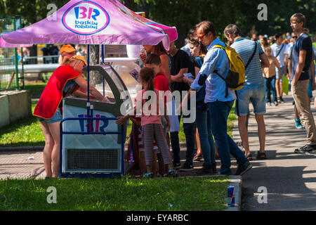 Moscow, Russia. 25th July, 2015. Moscow City Games 2015 sports festival took place at the Olympic Sport Complex Luzhniky of Moscow city. Hot summer weather. Unidentified people in line to buy an ice-cream. Credit:  Alex's Pictures/Alamy Live News Stock Photo