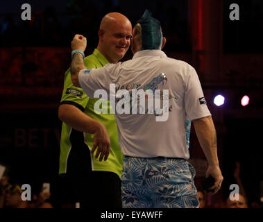 Michael van Gerwen (left) in action during their semi-final match ...