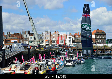 Portsmouth, Hampshire, UK - 25 July 2015  AC45f .Land Rover BAR led by Sir Ben Ainslie, craning in boat at his base in central Portsmouth and getting ready  for Races 1 and  2 today) of the Louis Vuitton America's Cup World Series Portsmouth. Six teams are competing being Land Rover BAR led by Sir Ben Ainslie, Oracle Team USA, Artemis Racing from Sweden, Emirates Team New Zealand, SoftBank Team Japan, and Groupama Team France all sailing the 'flying' AC45f. Credit:  Wendy Johnson  /Alamy Live News  (photographer media accredited for this event) Stock Photo