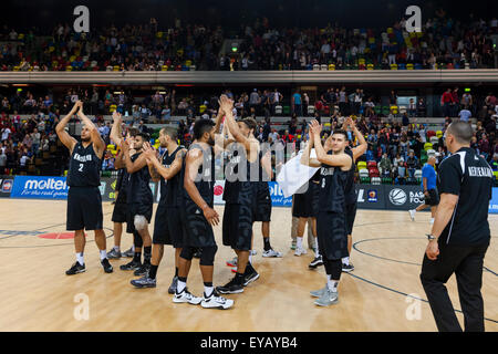 London, UK. 25th July, 2015. The NZ team celebrate their win after the Great Britain vs. New Zealand Tall Blacks basketball game at the Copper Box Arena in the Olympic Park. New Zealand win 84-63. Stock Photo