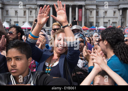 London, UK. 25th July, 2015. Thousands of people attends the EID celebrates the end of Ramadan of the 10th anniversary EID in the Square with lives music food and catwalk show, sponsor by Qatar Airline filled Trafalgar Square, London. Credit:  See Li/Alamy Live News Stock Photo