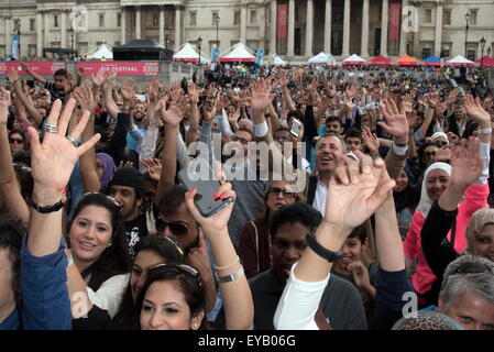 London, UK. 25th July, 2015. Thousands of people attends the EID celebrates the end of Ramadan of the 10th anniversary EID in the Square with lives music food and catwalk show, sponsor by Qatar Airline filled Trafalgar Square, London. Credit:  See Li/Alamy Live News Stock Photo