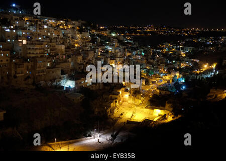 View at night of the Palestinian neighborhood of Silwan or Siloam a predominantly Palestinian neighborhood on the outskirts of the Old City of Jerusalem Israel Stock Photo