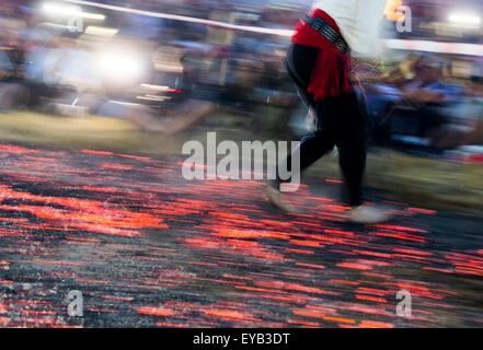 A nestinar is walking on fire during a nestinarstvo show. The fire ritual involves a barefoot dance on smouldering embers perfor Stock Photo