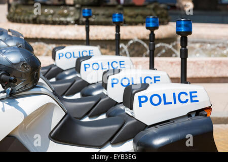 New police motorcycles in line with helmets on them. Stock Photo