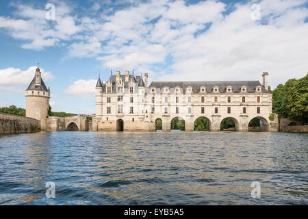 Chenonceau castle, built over the Cher river , Loire Valley,France, view from the river, on cloudu blue sky background. Stock Photo