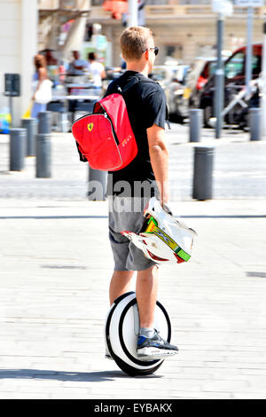 Marseilles France self balancing Solowheel type of powered one wheel unicycle in use by young man in Marseille (exact brand & model not known) Stock Photo