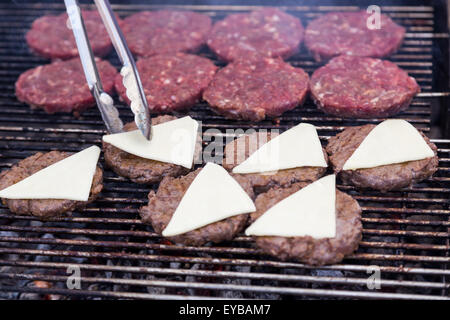 hot grill burger cutlet barbeque on grating above charcoal Stock Photo