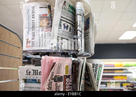 A selection of foreign newspapers on sale Stock Photo