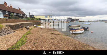 Boats at low tide at West Mersea, Mersea Island, near Colchester, Essex, East Anglia, England, United Kingdom. Stock Photo