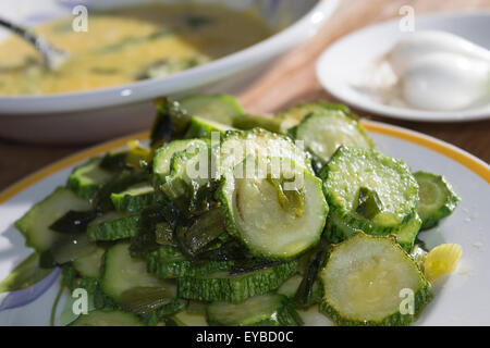 slices of fried zucchini in vegetable oil Stock Photo