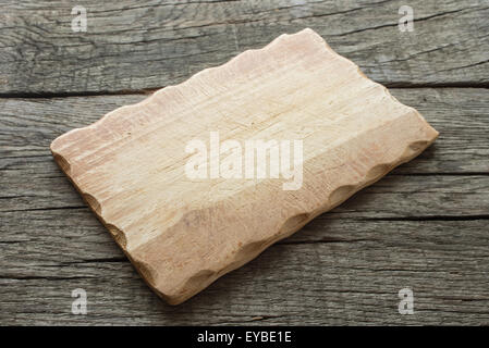 Cutting board on a rustic wooden oak table Stock Photo