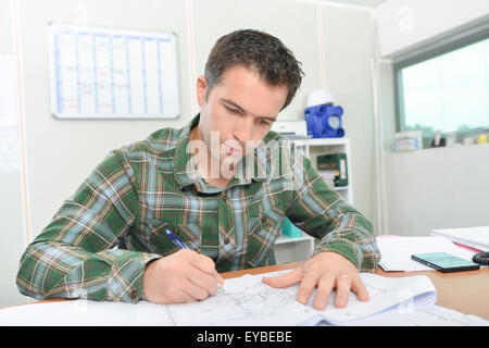 Architect working on plans Stock Photo