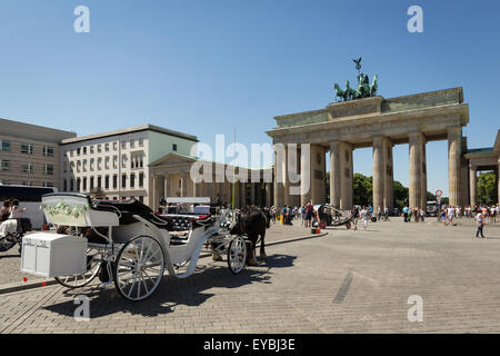 Brandenburg gate (Brandenburger Tor ) and horse carriage Stock Photo