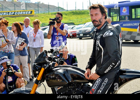 Actor Keanu Reeves test-rides his Arch Motorcycle 'KRGT-1' during the Suzuka 8 Hours FIM Endurance world championship at Suzuka Circuit in Mie prefecture, Japan on July 25, 2015. Stock Photo