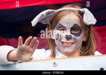 Swanage, Dorset UK 26 July 2015. Swanage Carnival Procession in July with the theme of Superheroes - young girl as spotty dalmatian dog Credit:  Carolyn Jenkins/Alamy Live News Stock Photo