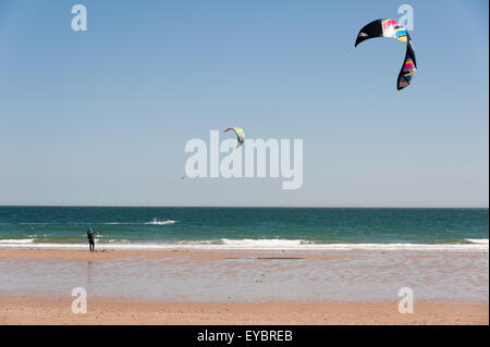 A kitesurfer on South Beach, Tenby, Pembrokeshire, Wales, UK. Stock Photo