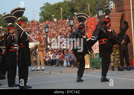 Lahore, Pakistan. 26th July, 2015. Pakistani rangers during a daily parade at the Pakistan-India joint check-post at Wagah border. India and Pakistan solemnly lowered their national flags at a dusk military ceremony on their main land border crossing. The flag-lowering ceremony is extremely popular on both sides, with crowds every day packing out bleachers set up on either side of the gates adorned with large, facing portraits of their founding fathers, Mahatma Gandhi on the Indian side and Mohammed Ali Jinnah on the Pakistani side. © Rana Sajid Hussain/Pacific Press/Alamy Live News Stock Photo