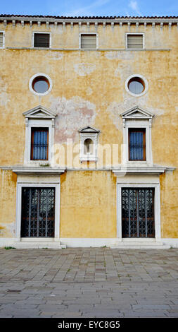 ancient building with windows and doors in Venice, Italy Stock Photo