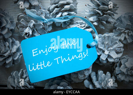 Light Blue Label On Fir Cones Quote Enjoy Little Things Stock Photo