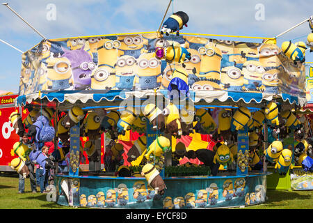 Minions soft cuddly toys to win on fairground stall in Swanage Stock Photo