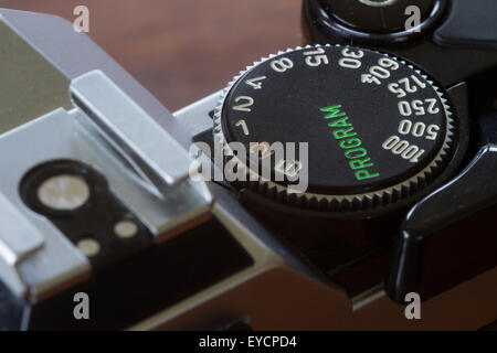 The top of an old Canon AE-1 Film camera showing the shutter speed selection and horseshoe. Stock Photo