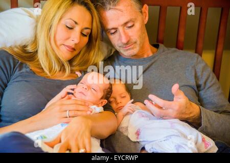 Couple with newborn twin girl and boy Stock Photo