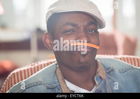 Portrait of mid adult man with carrot mustache Stock Photo