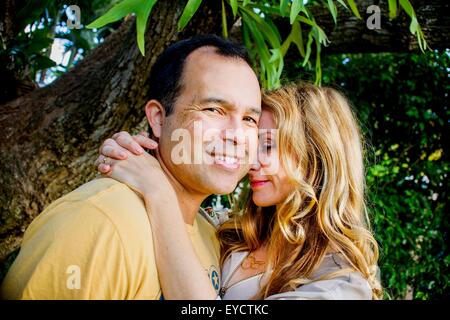 Portrait of affectionate mature couple in garden Stock Photo