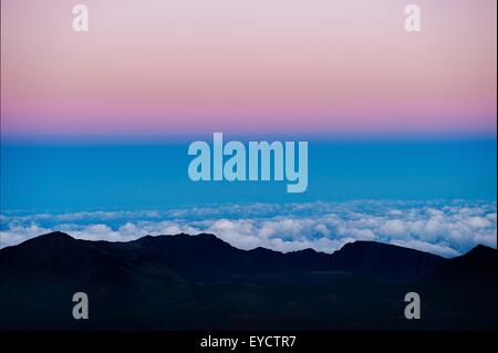 Silhouetted view at sunset, Haleakala National Park, Maui, Hawaii Stock Photo