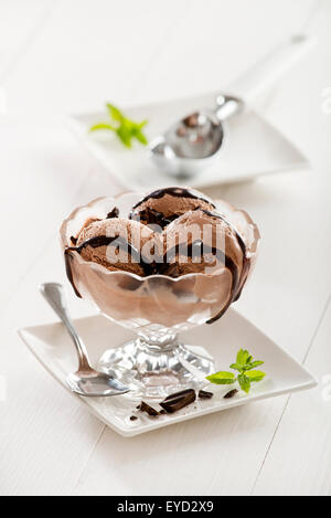 Chocolate ice cream with syrup in glass. Stock Photo
