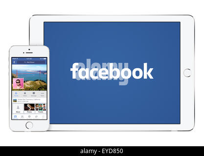 Varna, Bulgaria - February 02, 2015: Facebook app on the Apple iPhone 5s and Facebook new logo on the Apple iPad Air 2. Stock Photo