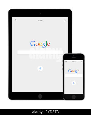 Varna, Bulgaria - February 02, 2015: Google search app on the Apple iPad Air 2 and iPhone 5s displays. Stock Photo