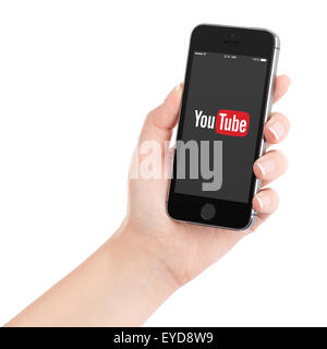 Varna, Bulgaria - February 02, 2015: Female hand holding Apple iPhone 5S with YouTube app on the display. Stock Photo