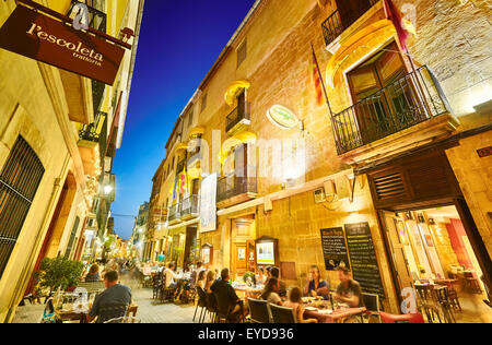 Restaurant terraces at Loreto street by night. Denia. Alicante. Valencia Community. Spain Stock Photo