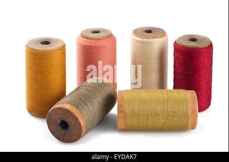 Colored spools of cotton thread isolated on white Stock Photo