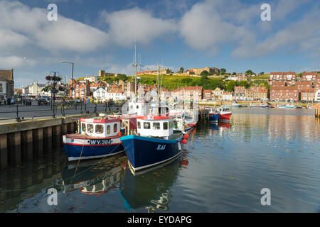 Fishing boats on the river Esk, at the harbour in Whitby, North Yorkshire, England, July 2015 Stock Photo
