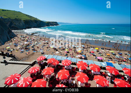 Sunbathing At Itzurun Beach, Zumaia, Basque Country, Spain Stock Photo