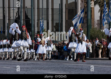 Greek guards (Tsoliades) regiment march outside Greek Parliament in Syntagma sq., to attend a ceremonial event. Athens,Greece Stock Photo