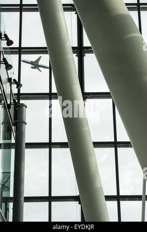 An aircraft takes off at Heathrow Terminal 5 Stock Photo