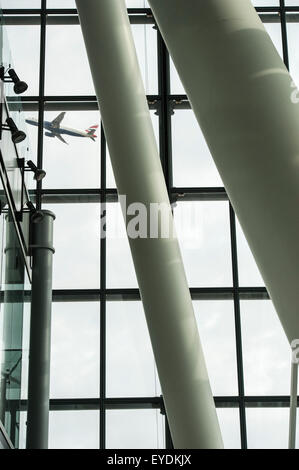 An aircraft takes off at Heathrow Terminal 5 Stock Photo