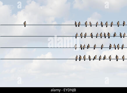 Individuality symbol and independent thinker concept and new leadership concept or individuality as a group of pigeon birds on a Stock Photo