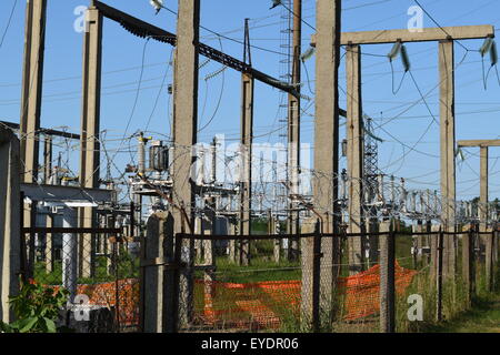Power substation. Small distributive power substation in the settlement. Stock Photo