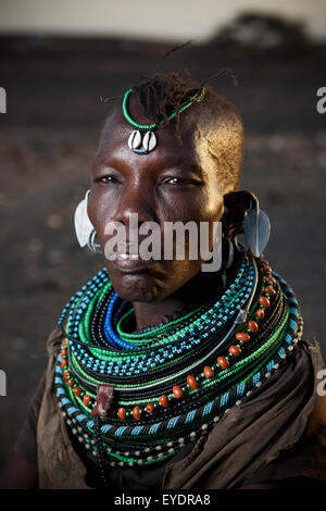 Kenya, Portrait of traditionally dressed Turkana woman on Lake Turkana; Loyangalani Stock Photo