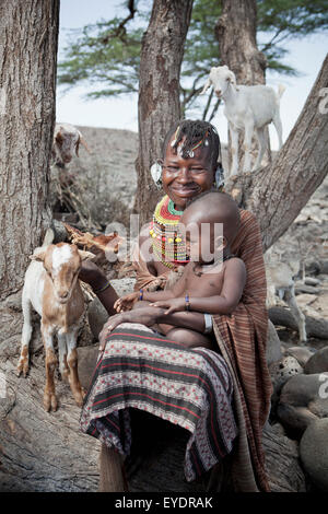 Kenya, Portrait of traditionally dressed Turkana woman and child on Lake Turkana; Loyangalani Stock Photo