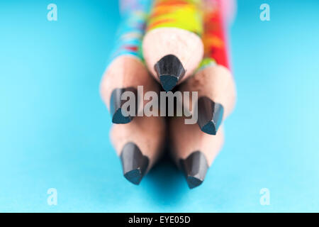 Group of pencils against blue background Stock Photo